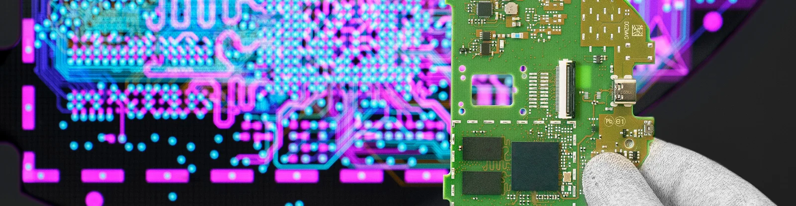 Cicor engineer holding a PCB in front of a screen displaying the PCB design