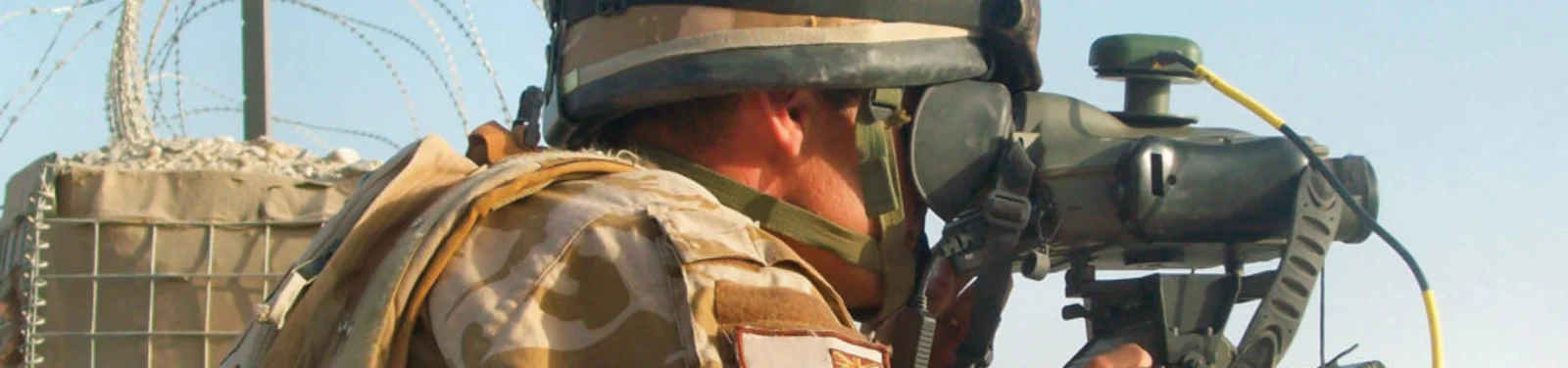 Soldier operating targeting equipment, illustrating Cicor land defence electronics.