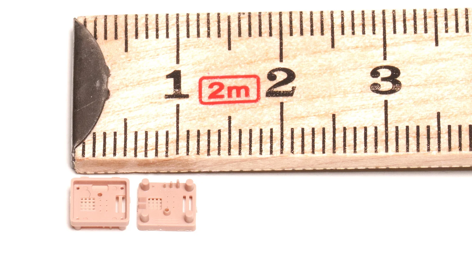 Close-up of a micro-molded plastic part demonstrating Cicor's precision plastics capabilities.