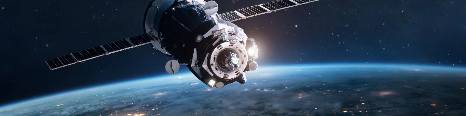 Satellite orbiting Earth, highlighting Cicor electronic solutions for space missions.