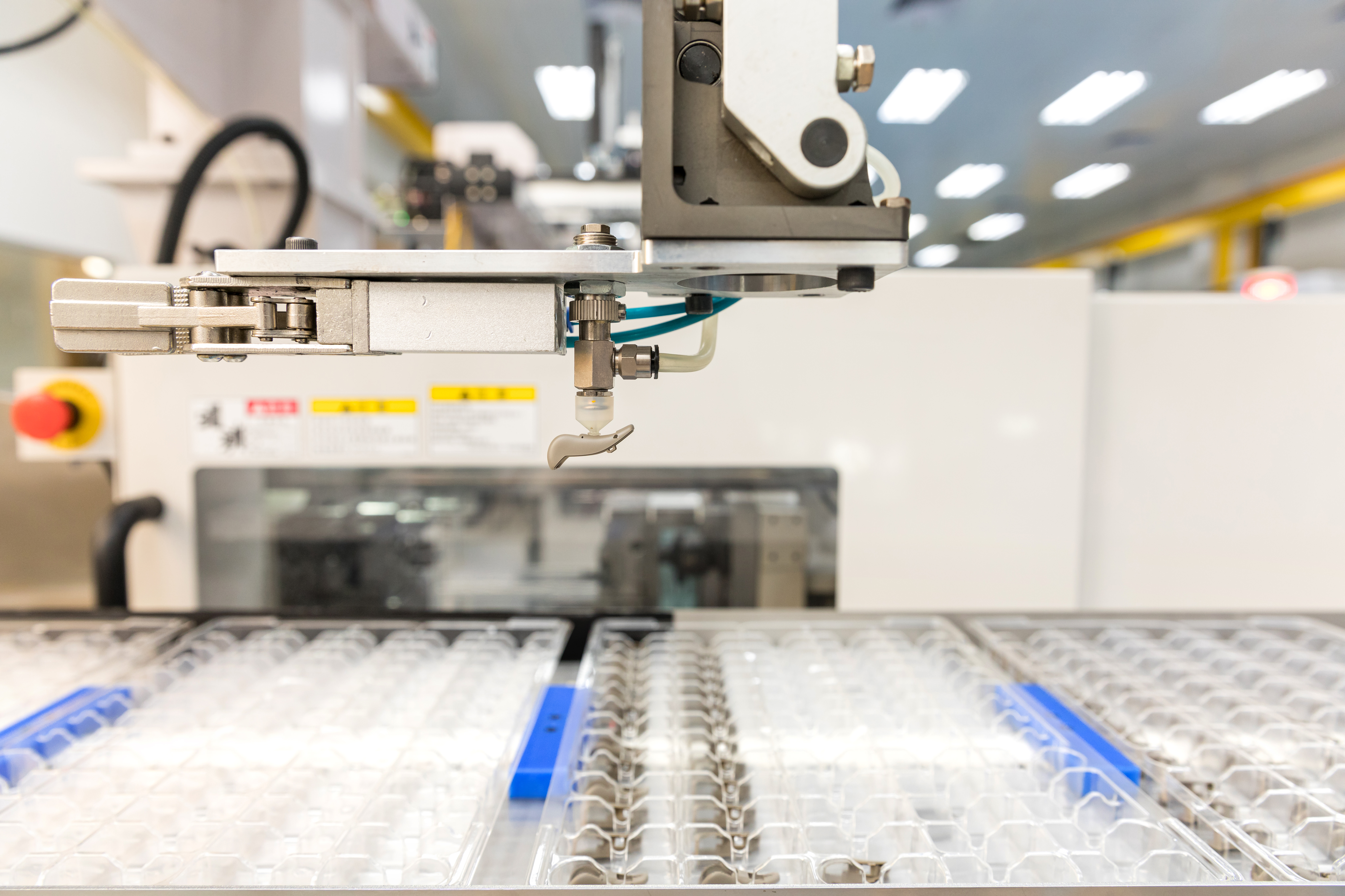 Plastic injection molding of a hearing aid component at the Cicor site in Batam